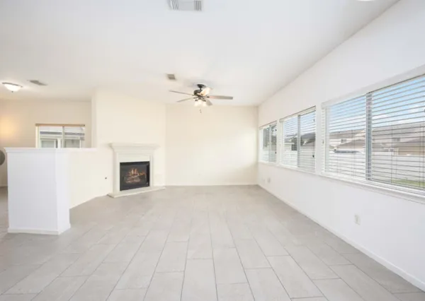 wooden floor in an empty room with a fireplace