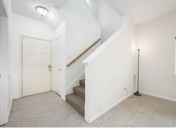 a view of an entryway with staircase