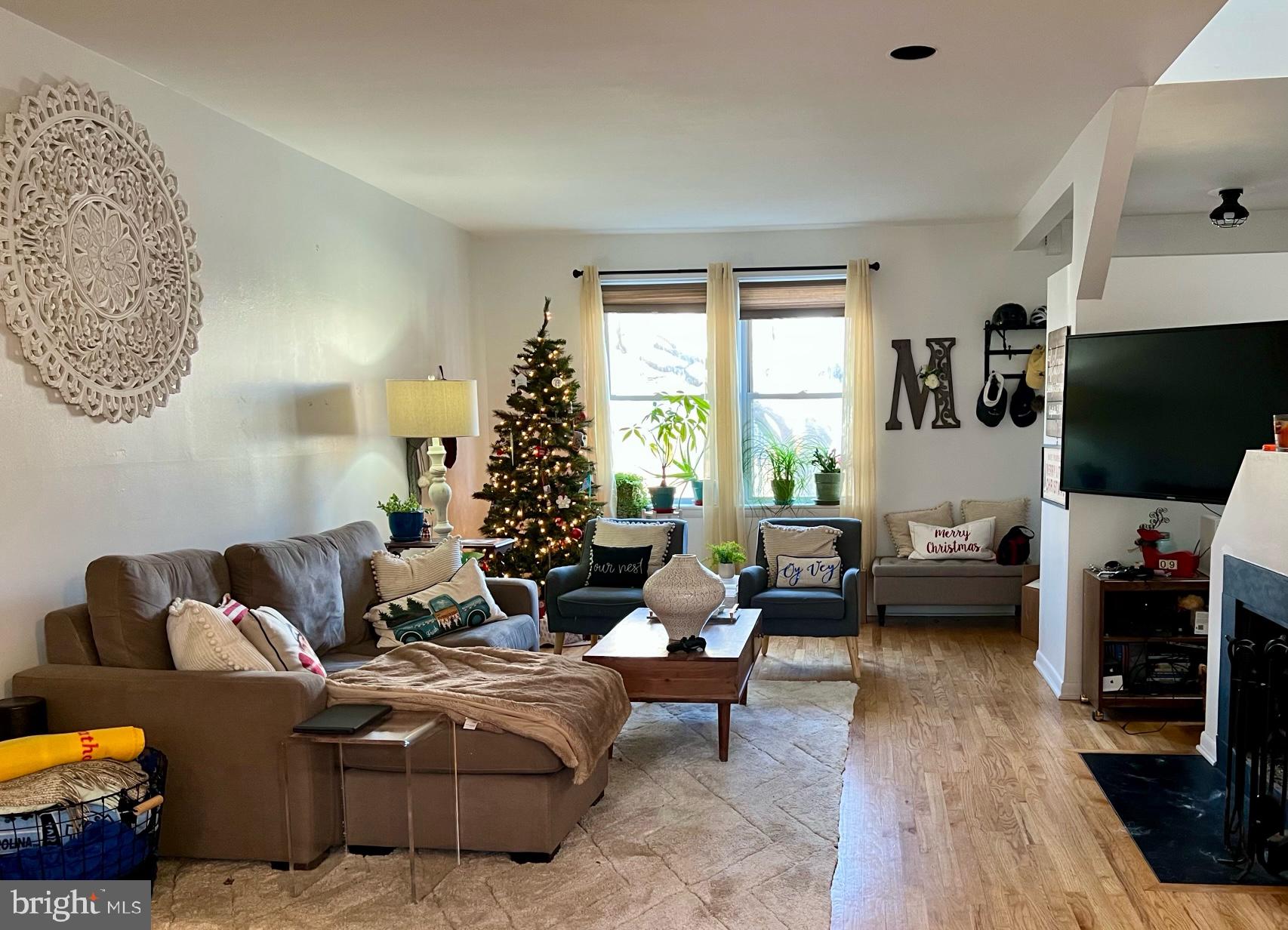 439 15th Street Northeast Washington, DC 20002 - Photo 5 of 17 a living room with furniture and a flat screen tv