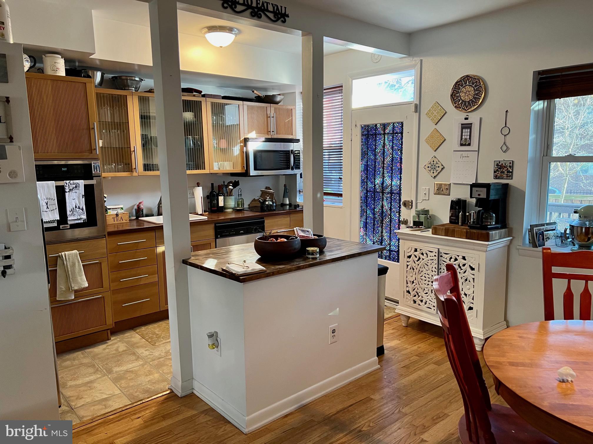 439 15th Street Northeast Washington, DC 20002 - Photo 7 of 17 a kitchen with stainless steel appliances granite countertop a sink stove and refrigerator