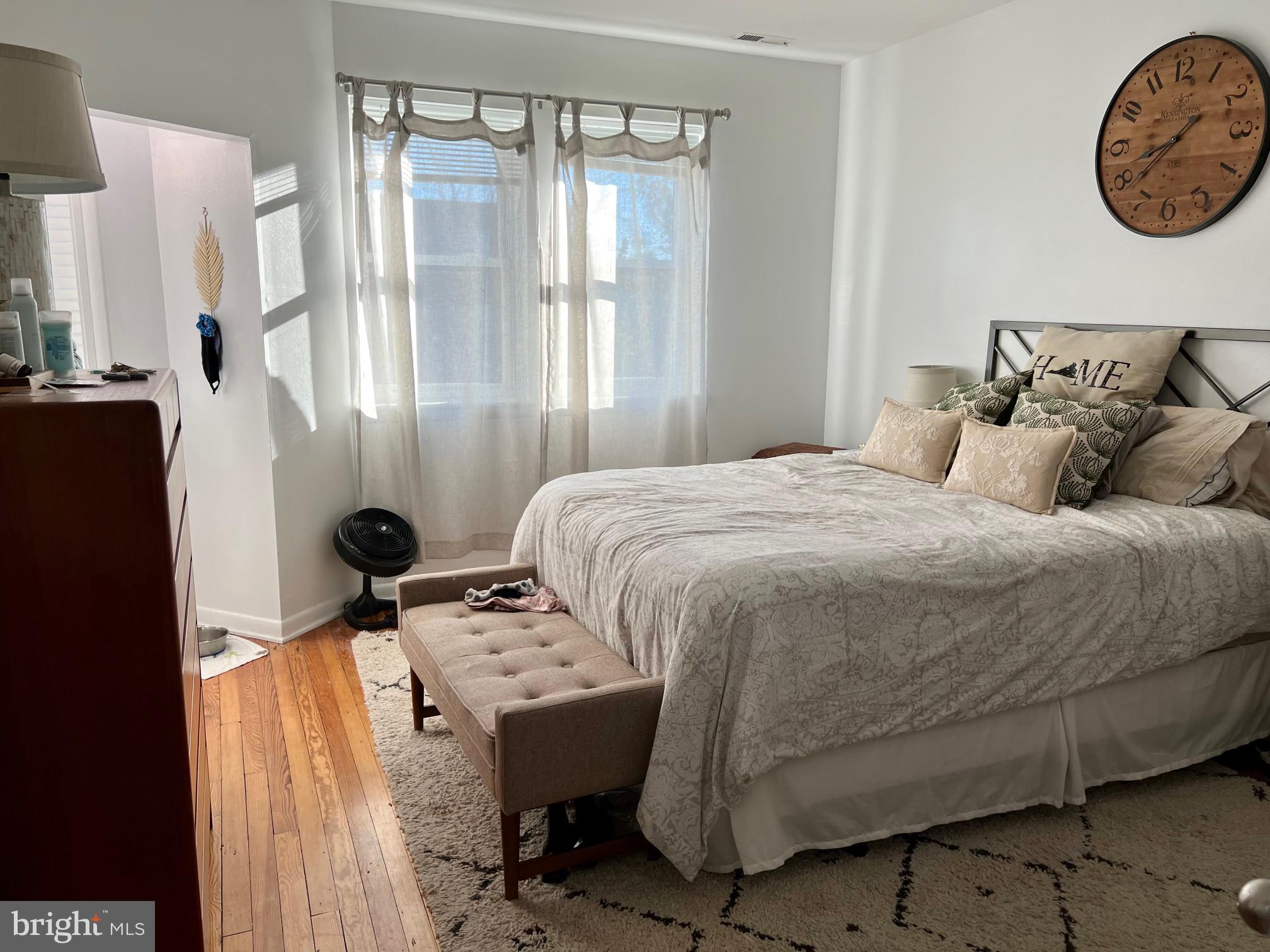 439 15th Street Northeast Washington, DC 20002 - Photo 9 of 17 a bedroom with a bed and a window