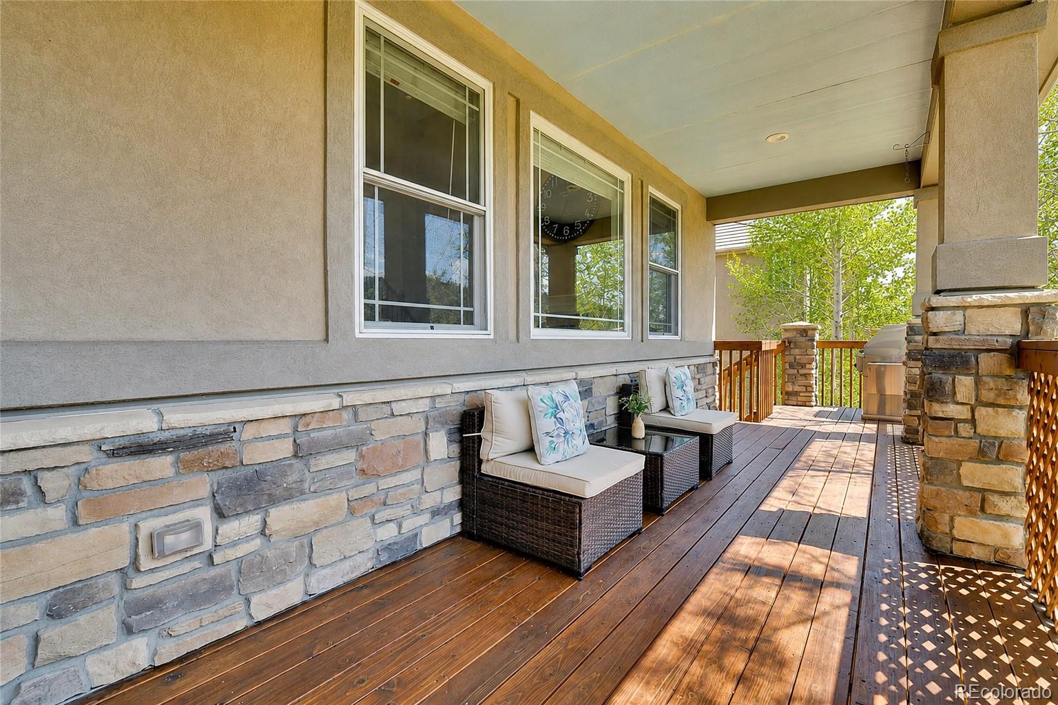 791 Elk Rest Road Evergreen, CO 80439 - Photo 15 of 46 a view of a living room and balcony