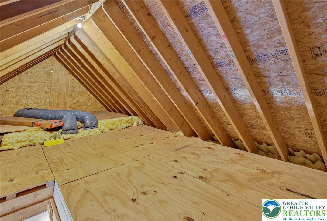 1702 Red Bud Road Quakertown, PA 18951 - Photo 53 of 68 Ready for transformation, this spacious attic offers abundant storage potential and structural integrity.
