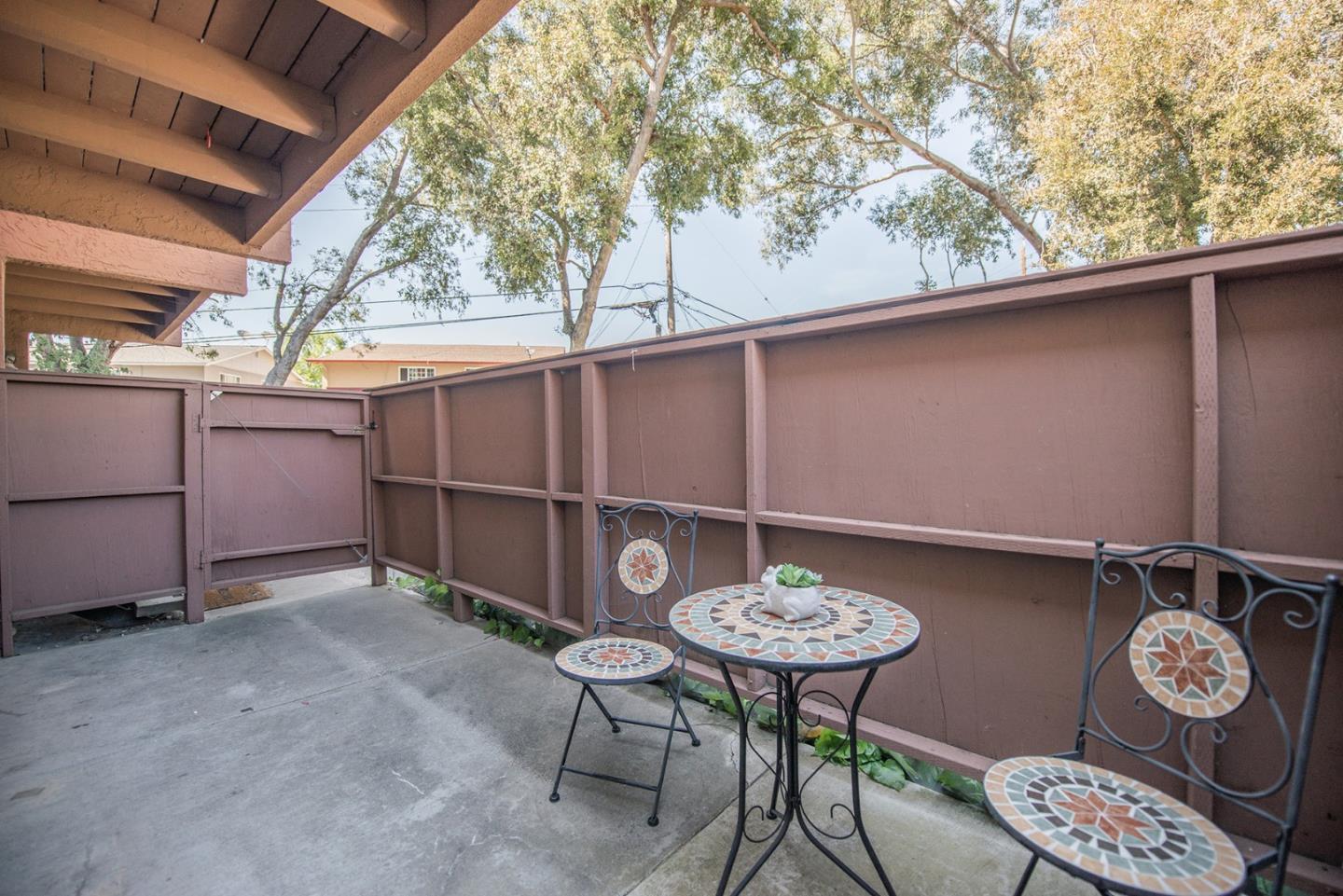 492 Dempsey Road, Unit 193 Milpitas, CA 95035 - Photo 19 of 35 a table that has a table and a chair and potted plant on it