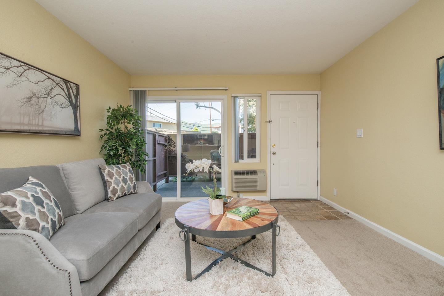 492 Dempsey Road, Unit 193 Milpitas, CA 95035 - Photo 2 of 35 a living room with furniture and a large window