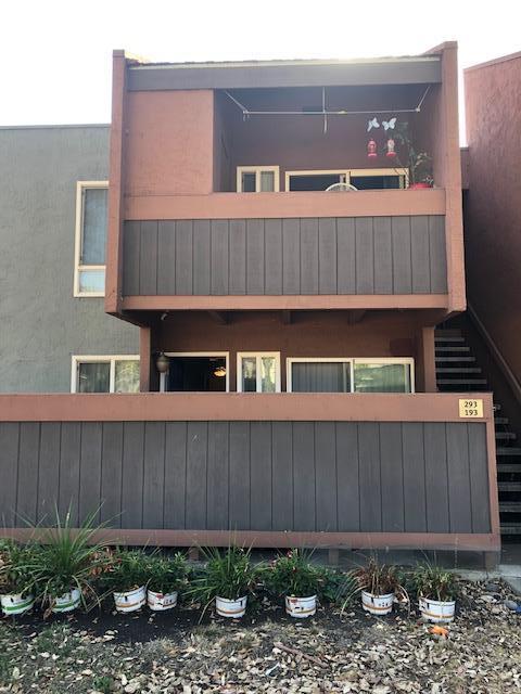 492 Dempsey Road, Unit 193 Milpitas, CA 95035 - Photo 22 of 35 a front view of a house with plants and a fence