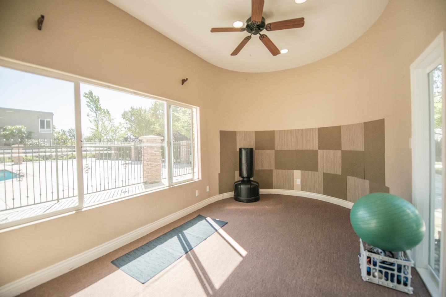 492 Dempsey Road, Unit 193 Milpitas, CA 95035 - Photo 25 of 35 a living room with a bed furniture and a large window