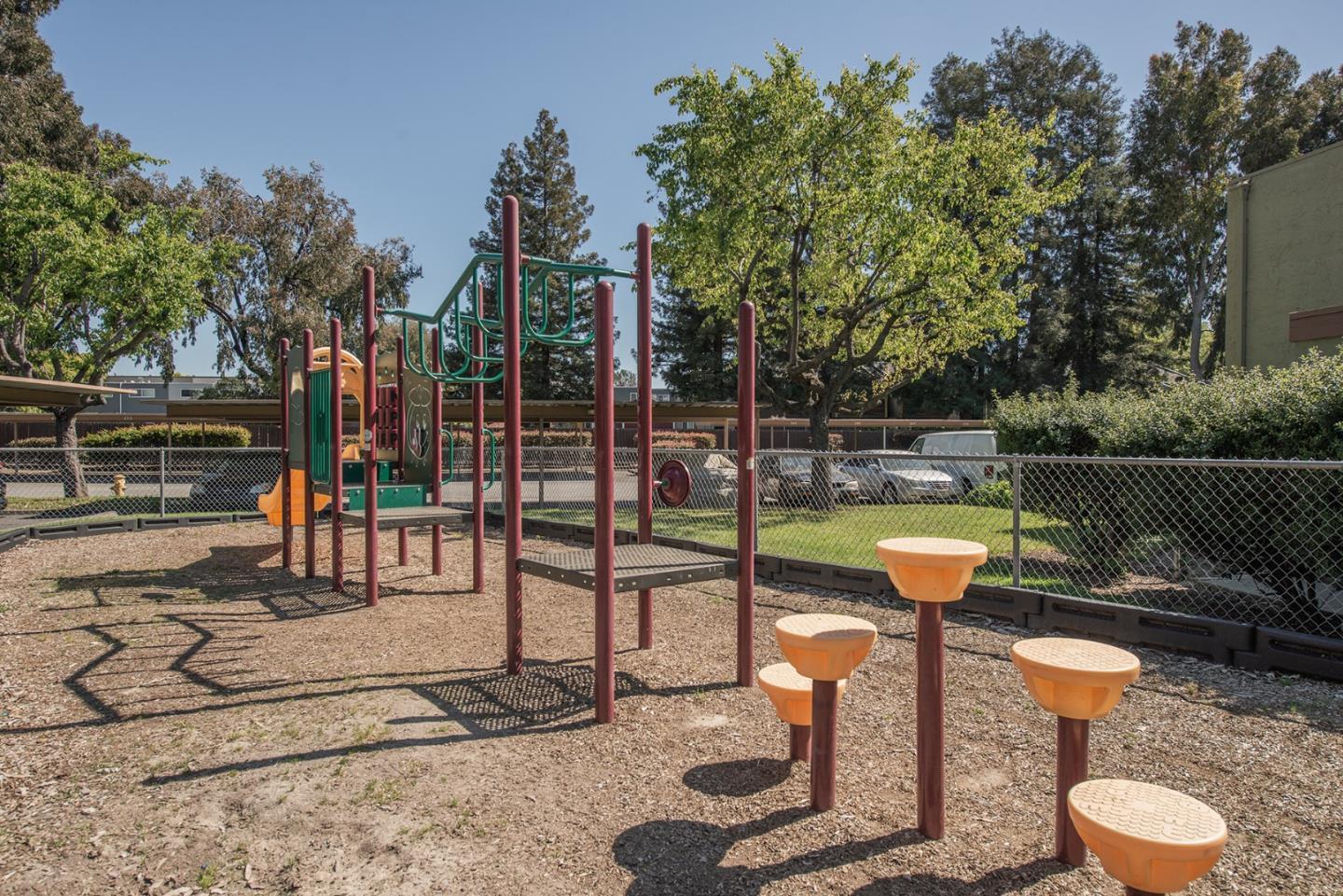 492 Dempsey Road, Unit 193 Milpitas, CA 95035 - Photo 31 of 35 a swimming pool with some trees in the background