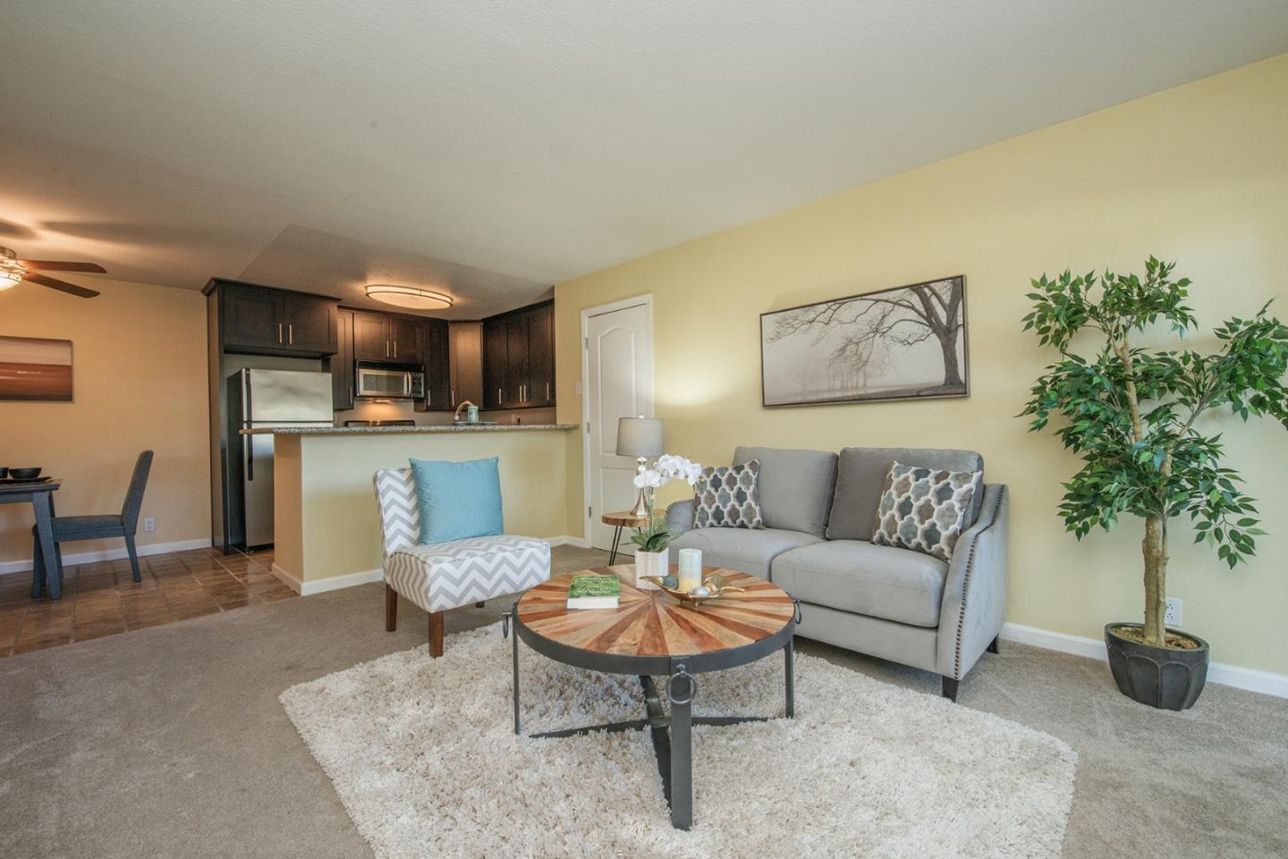 492 Dempsey Road, Unit 193 Milpitas, CA 95035 - Photo 4 of 35 a living room with furniture and a table