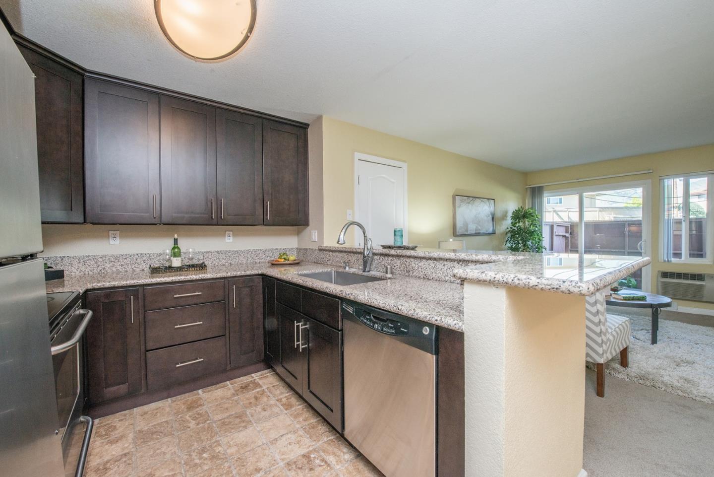 492 Dempsey Road, Unit 193 Milpitas, CA 95035 - Photo 5 of 35 a kitchen with a sink and a stove