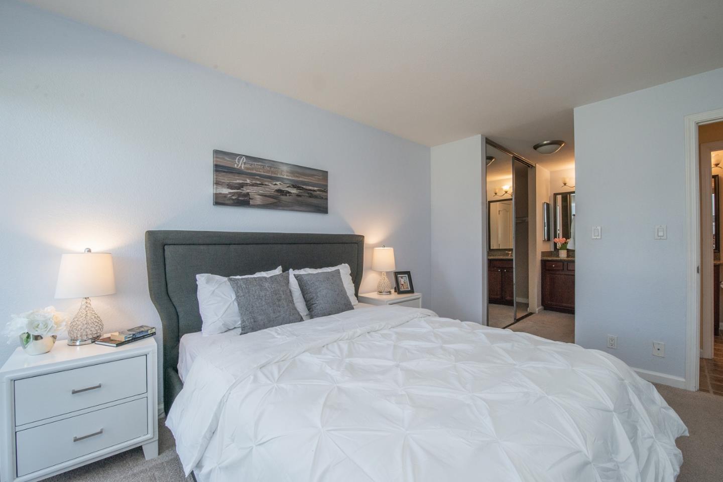 492 Dempsey Road, Unit 193 Milpitas, CA 95035 - Photo 7 of 35 a bedroom with a bed and a night stand