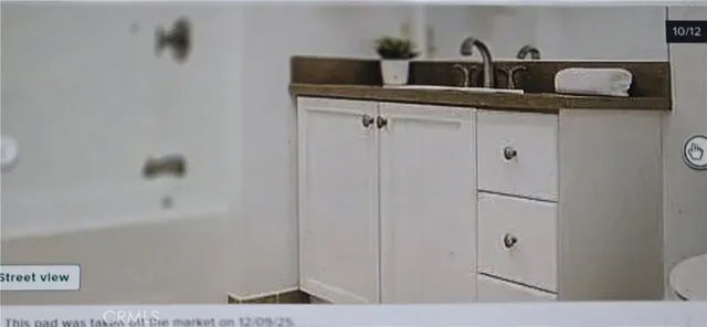 a bathroom with a sink and vanity
