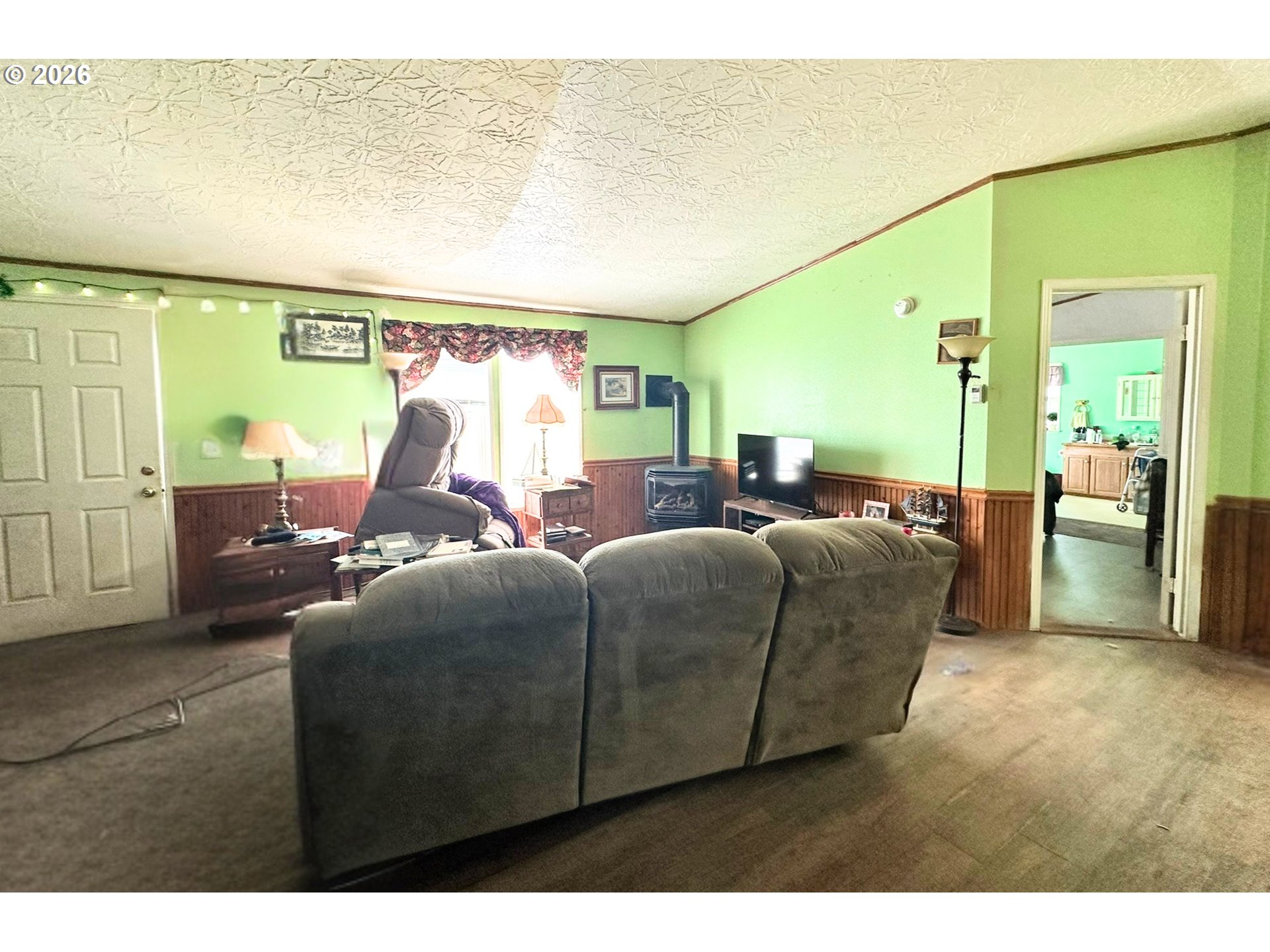 4821 Northeast 50th Street Neotsu, OR 97364 - Photo 5 of 19 a living room with furniture and a lamp
