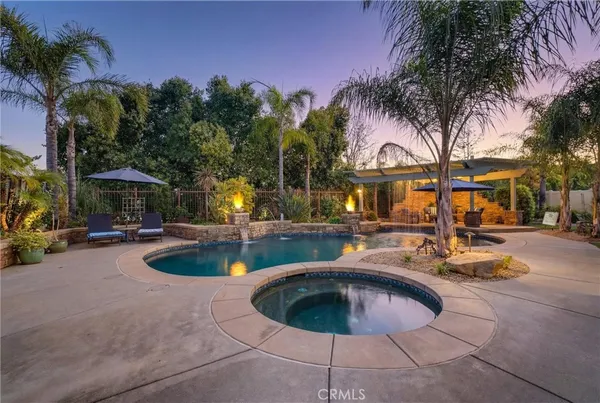 a view of a swimming pool with a patio