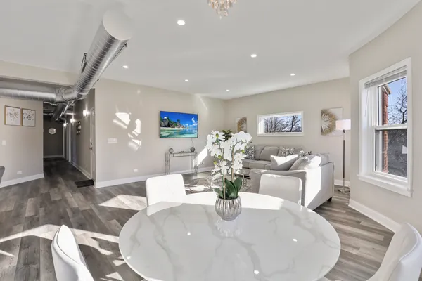 a living room with furniture and a table