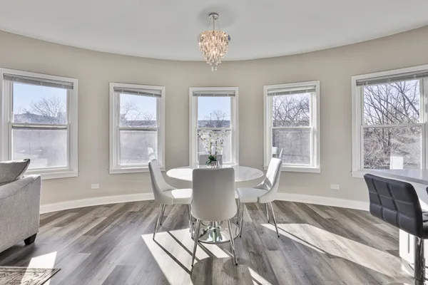 a view of a dining room with furniture window and outside view