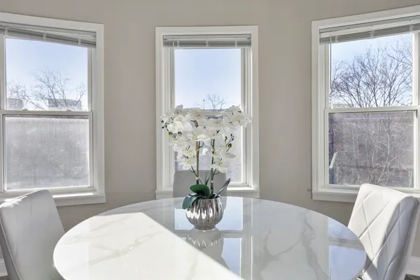 a dining room with furniture and wooden floor