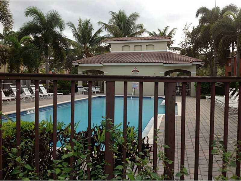 3395 Merrick Court, Unit 1110 Margate, FL 33063 - Photo 16 of 16 a view of a house with a flower garden