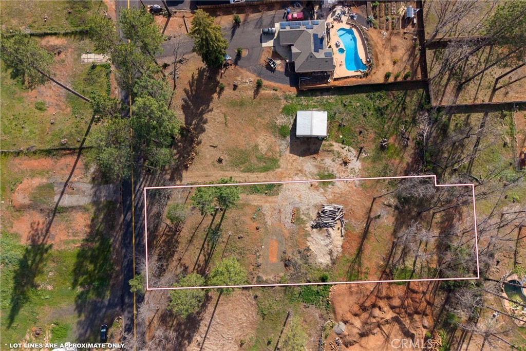 an aerial view of houses with street