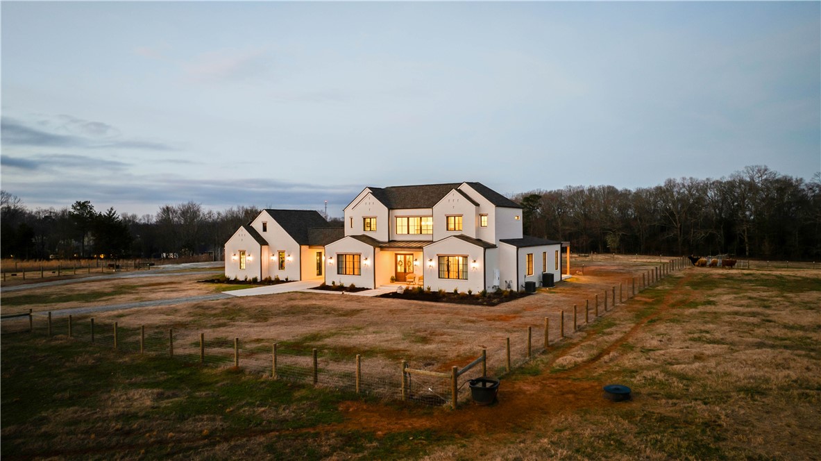 2811 Lebanon Road Pendleton, SC 29670 - Photo 3 of 50 This expansive estate offers a sprawling facade with classic charm, perfect for rural living.