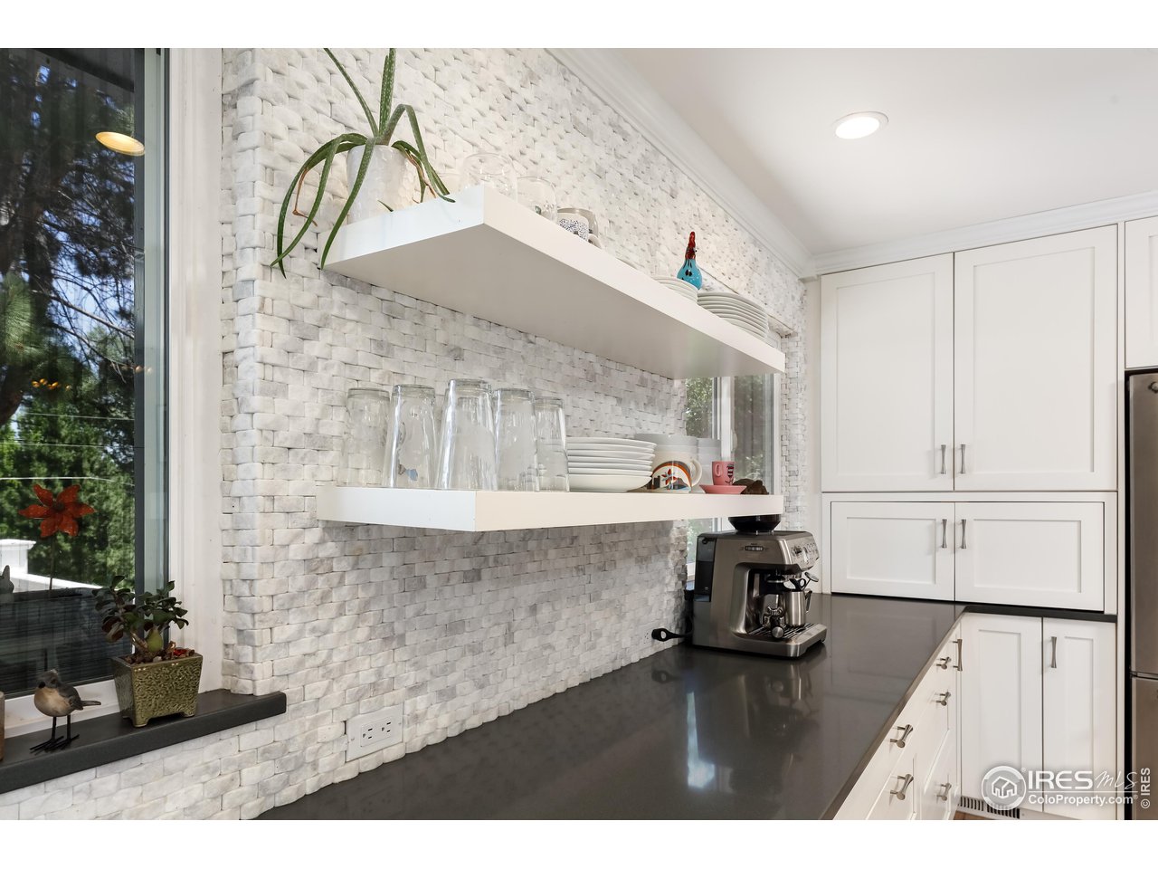 5825 Rustic Knolls Drive Boulder, CO 80301 - Photo 9 of 40 a living room with kitchen island granite countertop furniture and a kitchen view