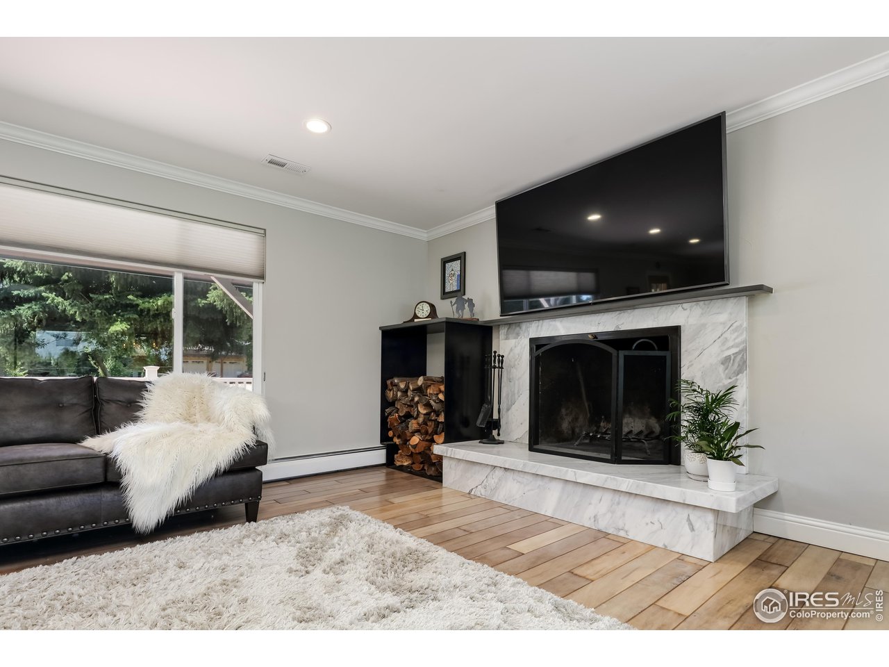 5825 Rustic Knolls Drive Boulder, CO 80301 - Photo 10 of 40 a living room with furniture and a fireplace