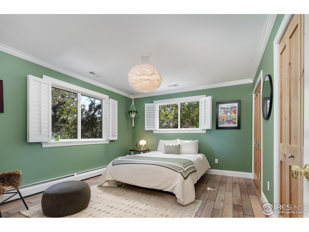 5825 Rustic Knolls Drive Boulder, CO 80301 - Photo 11 of 40 a bedroom with a bed and a window
