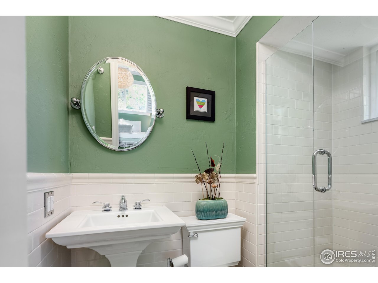 5825 Rustic Knolls Drive Boulder, CO 80301 - Photo 12 of 40 a bathroom with a sink and a mirror