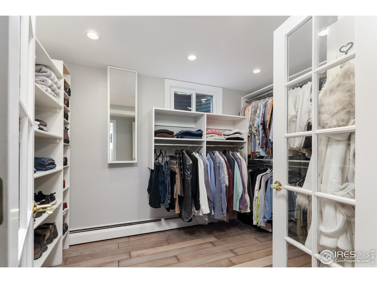 5825 Rustic Knolls Drive Boulder, CO 80301 - Photo 20 of 40 a view of walk in closet with clothes and shoes