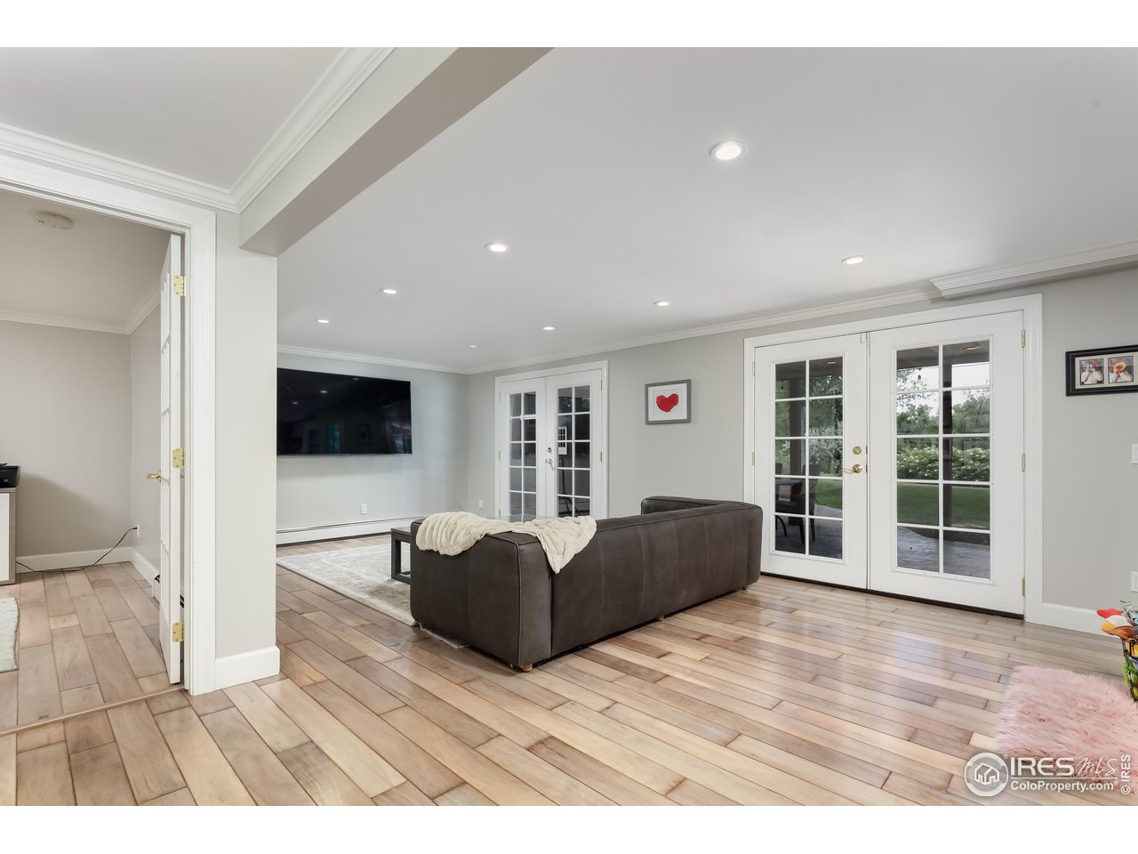 5825 Rustic Knolls Drive Boulder, CO 80301 - Photo 23 of 40 a living room with furniture and a flat screen tv