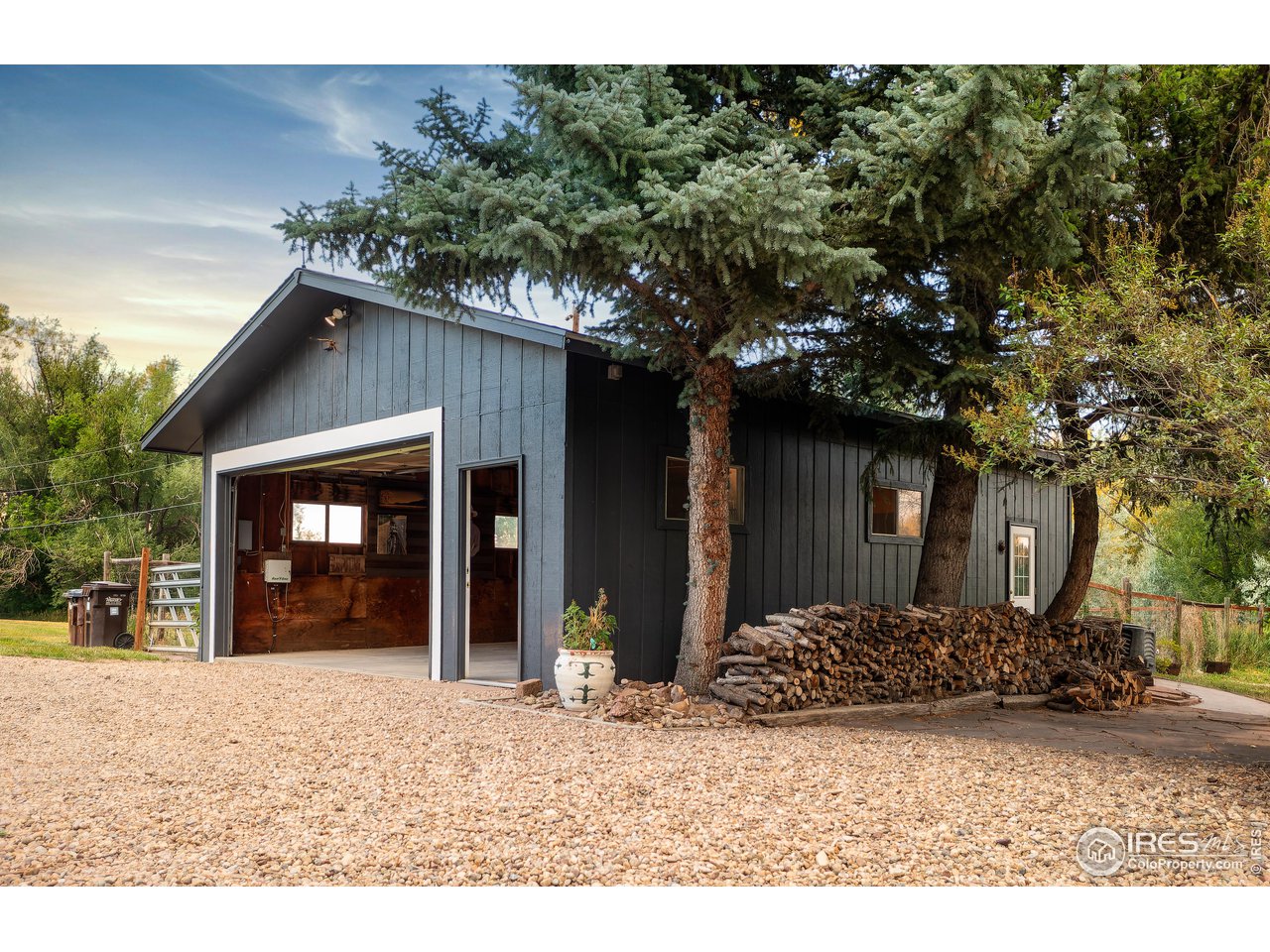 5825 Rustic Knolls Drive Boulder, CO 80301 - Photo 27 of 40 a front view of a house with a yard