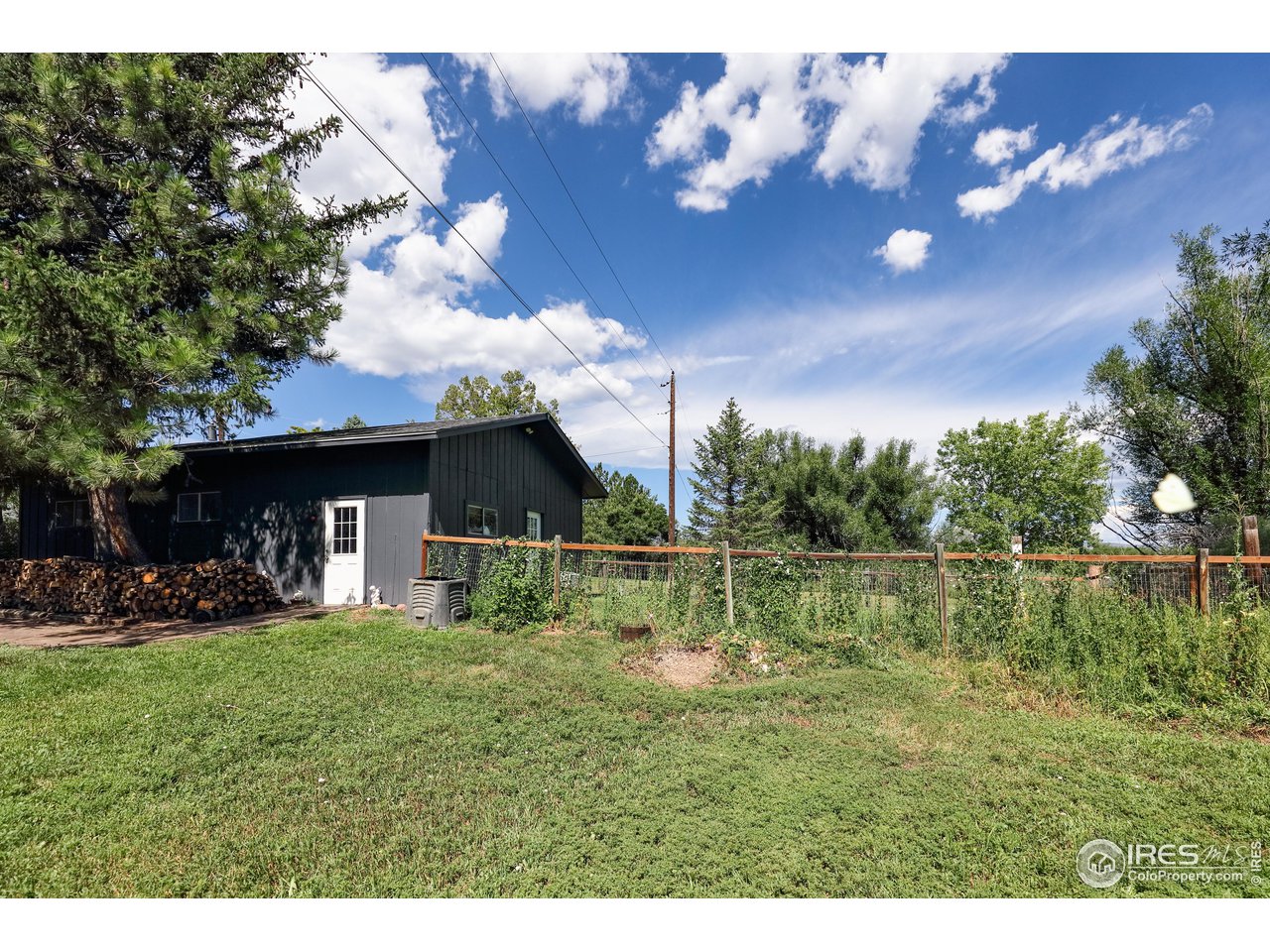 5825 Rustic Knolls Drive Boulder, CO 80301 - Photo 34 of 40 a view of a yard with a house in the background