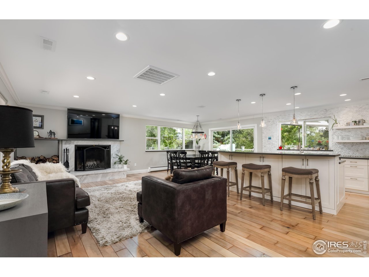 5825 Rustic Knolls Drive Boulder, CO 80301 - Photo 38 of 40 a living room with fireplace furniture and a flat screen tv