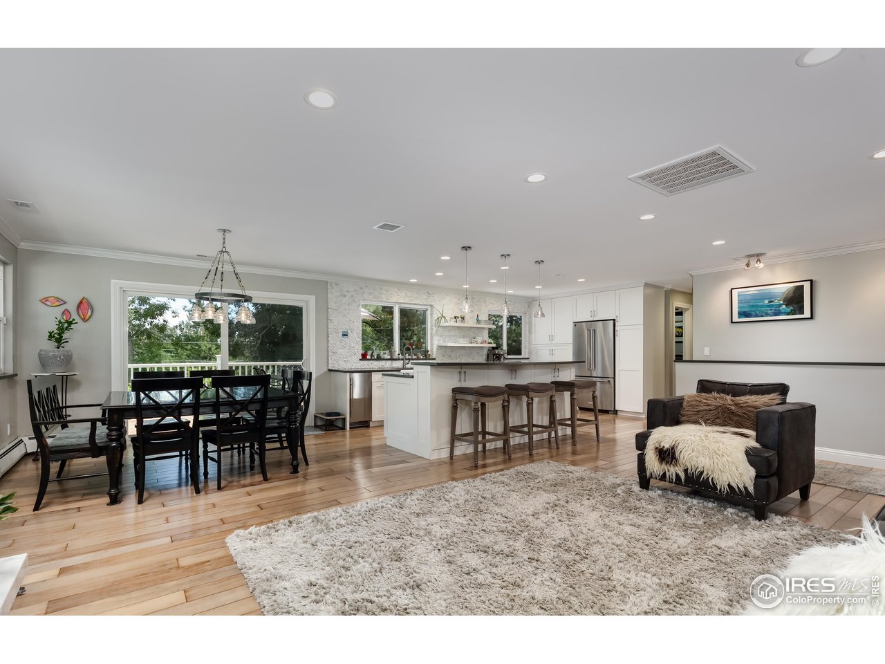 5825 Rustic Knolls Drive Boulder, CO 80301 - Photo 4 of 40 a living room with furniture a dining table and kitchen view
