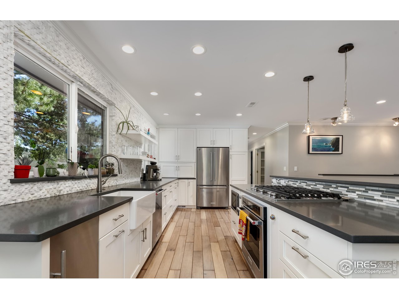 5825 Rustic Knolls Drive Boulder, CO 80301 - Photo 7 of 40 a kitchen with stainless steel appliances granite countertop a sink stove and refrigerator