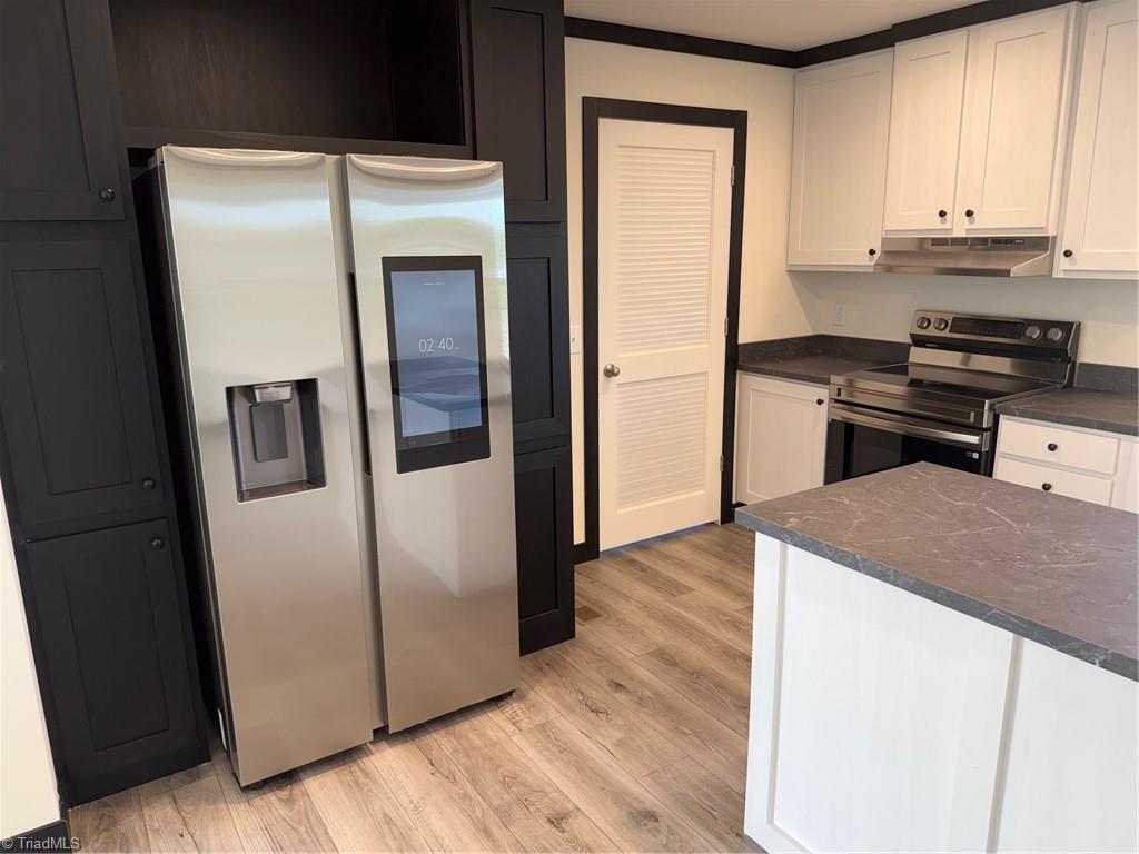 155 Little Elkin Church Road Ronda, NC 28670 - Photo 4 of 17 Refrigerator and Laundry door