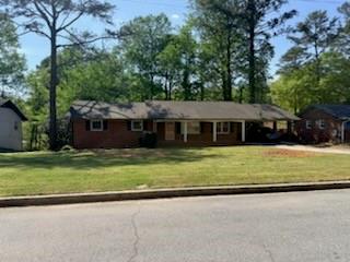 4609 Hopewell Road Atlanta, GA 30337 - Photo 1 of 1 a front view of a house with a garden
