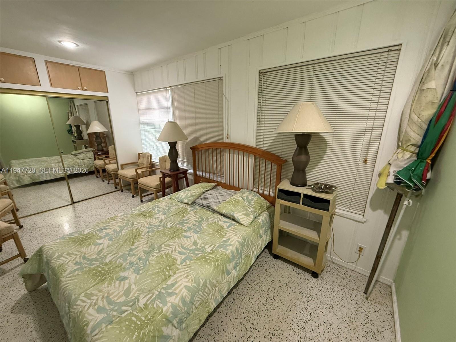 2560 Southwest 22nd Avenue Miami, FL 33133 - Photo 12 of 15 a bed room with a bed and a flat tv screen