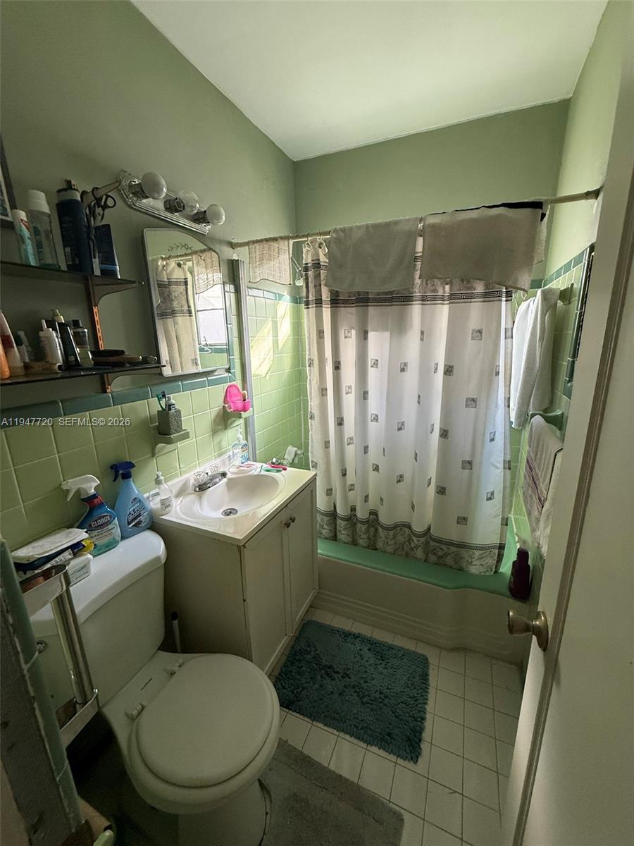 2560 Southwest 22nd Avenue Miami, FL 33133 - Photo 5 of 15 a bathroom with a sink toilet and shower