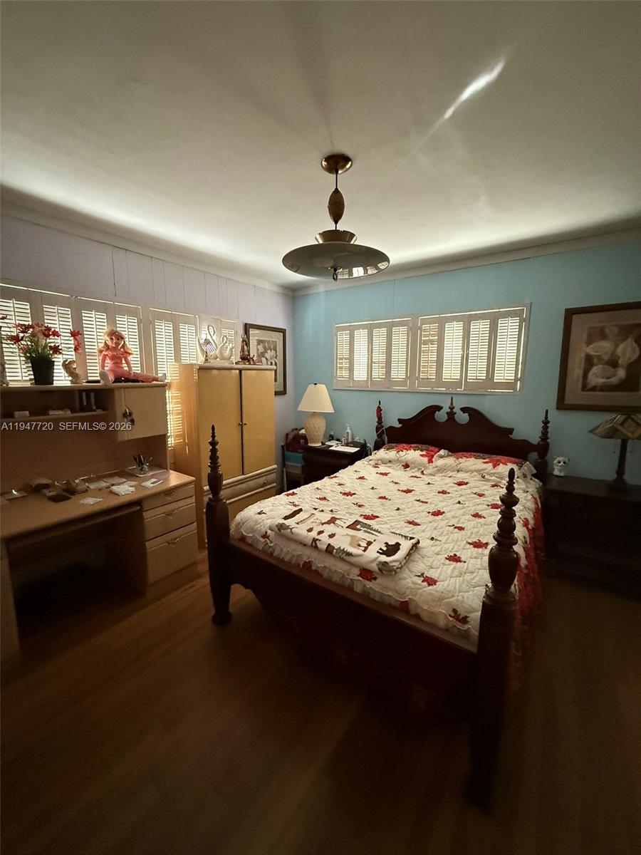 2560 Southwest 22nd Avenue Miami, FL 33133 - Photo 6 of 15 a bed sitting in a room next to a window