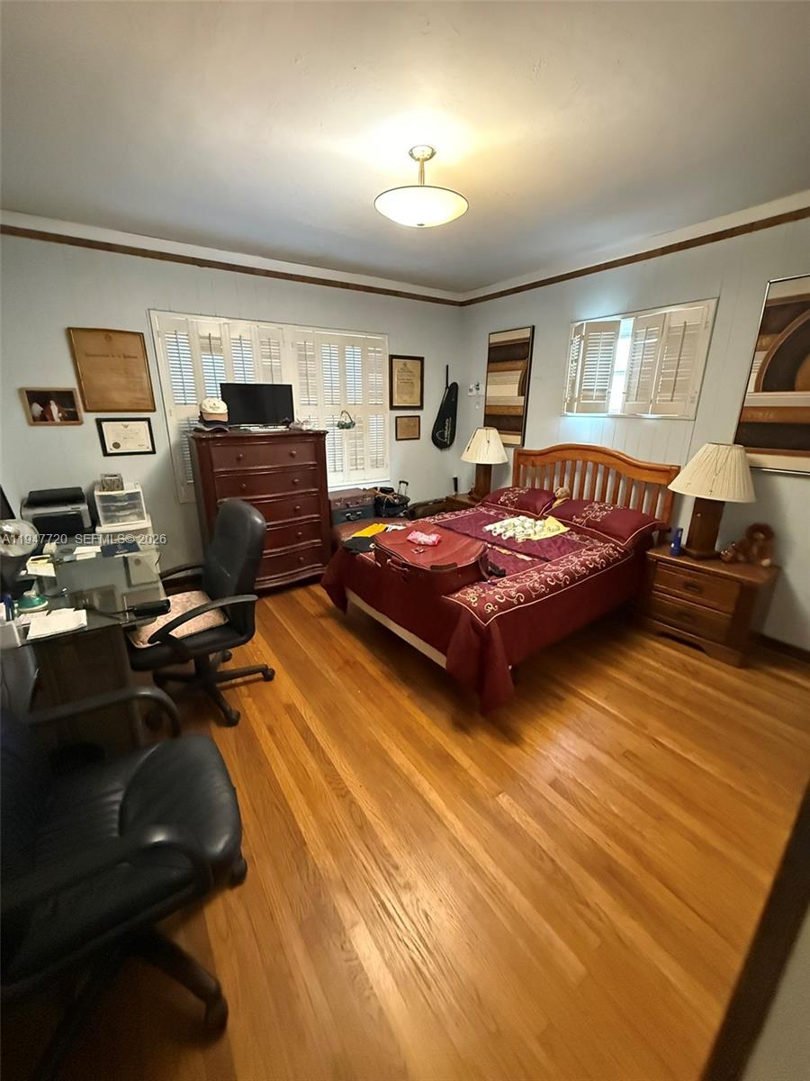 2560 Southwest 22nd Avenue Miami, FL 33133 - Photo 7 of 15 a bedroom with bed and window