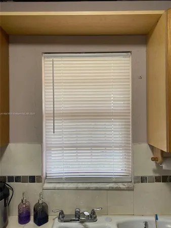 a view of a sink and a window