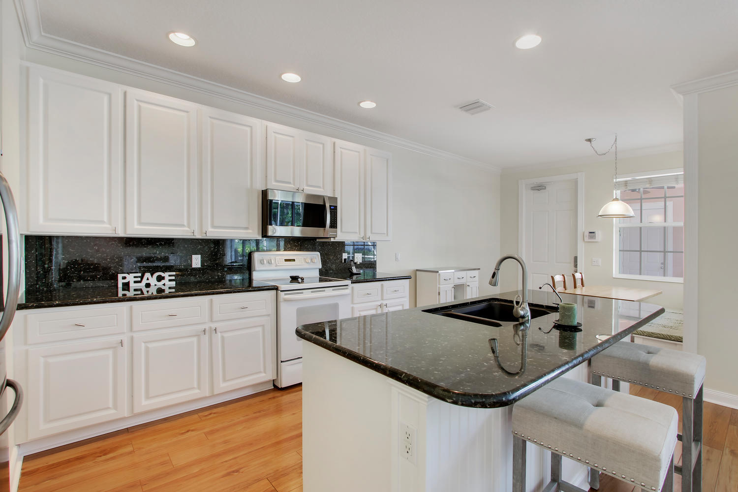 214 New Haven Boulevard Jupiter, FL 33458 - Photo 7 of 30 Kitchen with Granite Counters