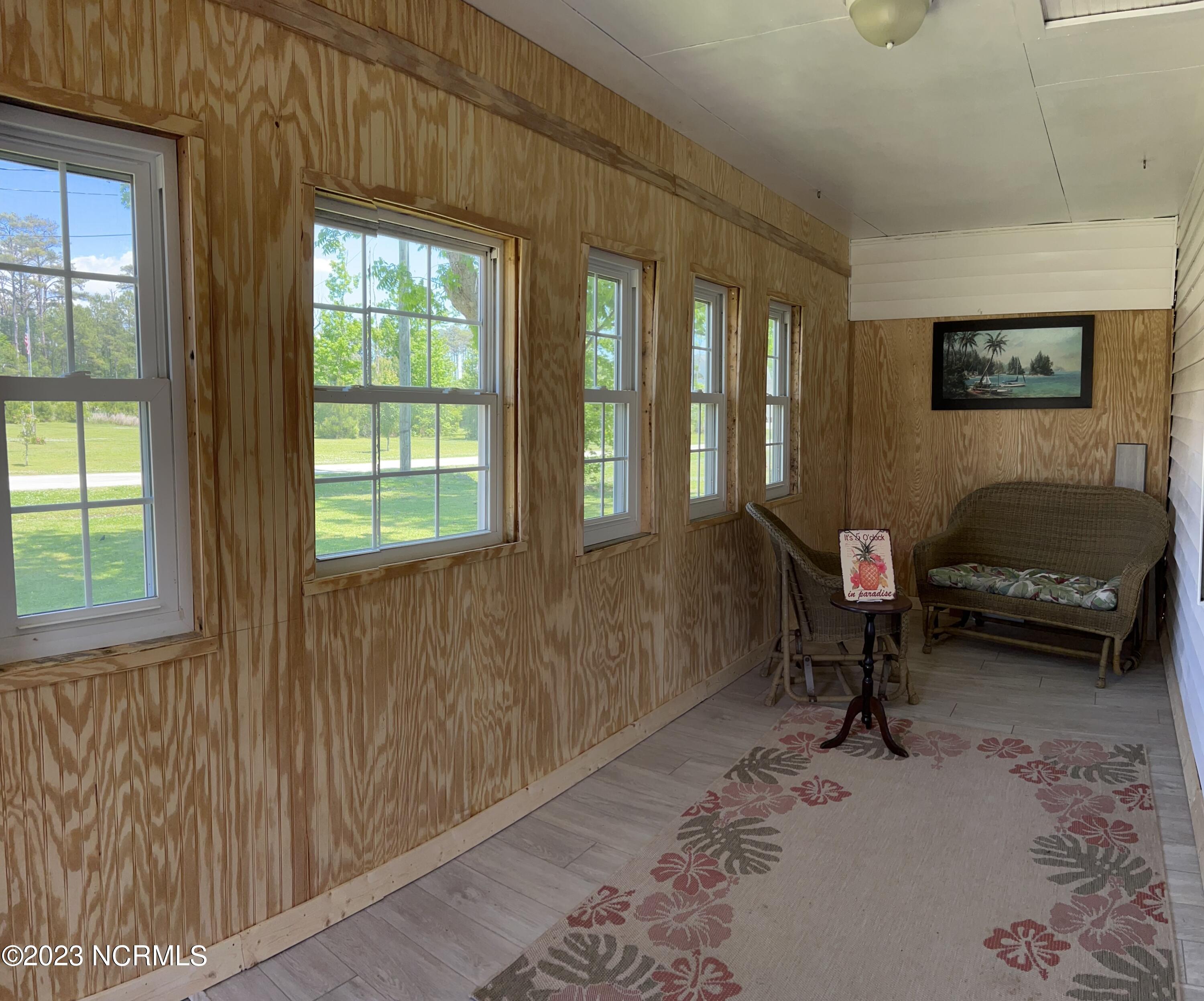 141 Black Duck Road Davis, NC 28524 - Photo 4 of 36 141 Black Duck Enclosed Porch 1