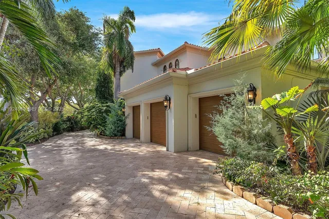 a view of a house with a tree
