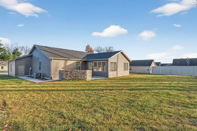 a swimming pool view with a outdoor seating