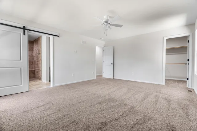 a view of an empty room with a cabinet