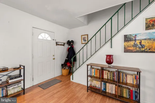 a view of an entryway with wooden floor