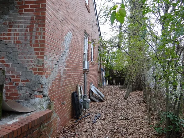 a brick building with a bench
