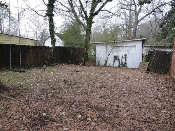 a backyard of a house with lots of green space